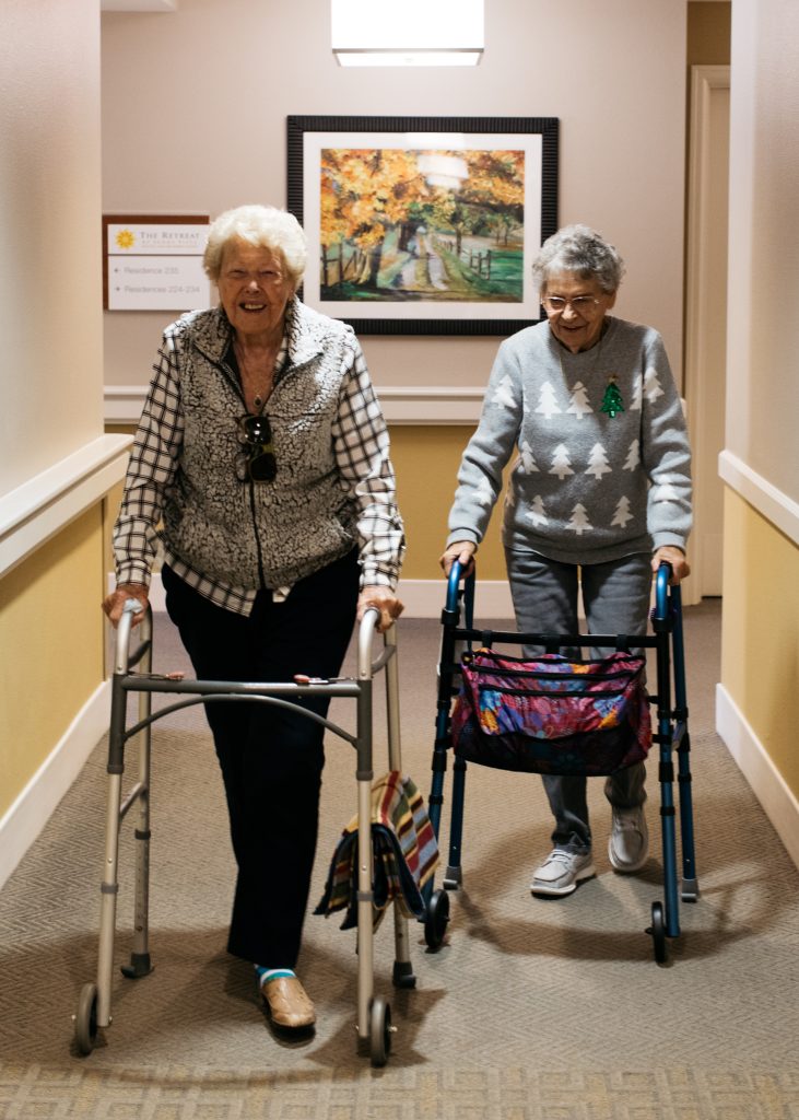 Sunny Vista Senior Living Community in Colorado Springs, CO - the retreat residents walking