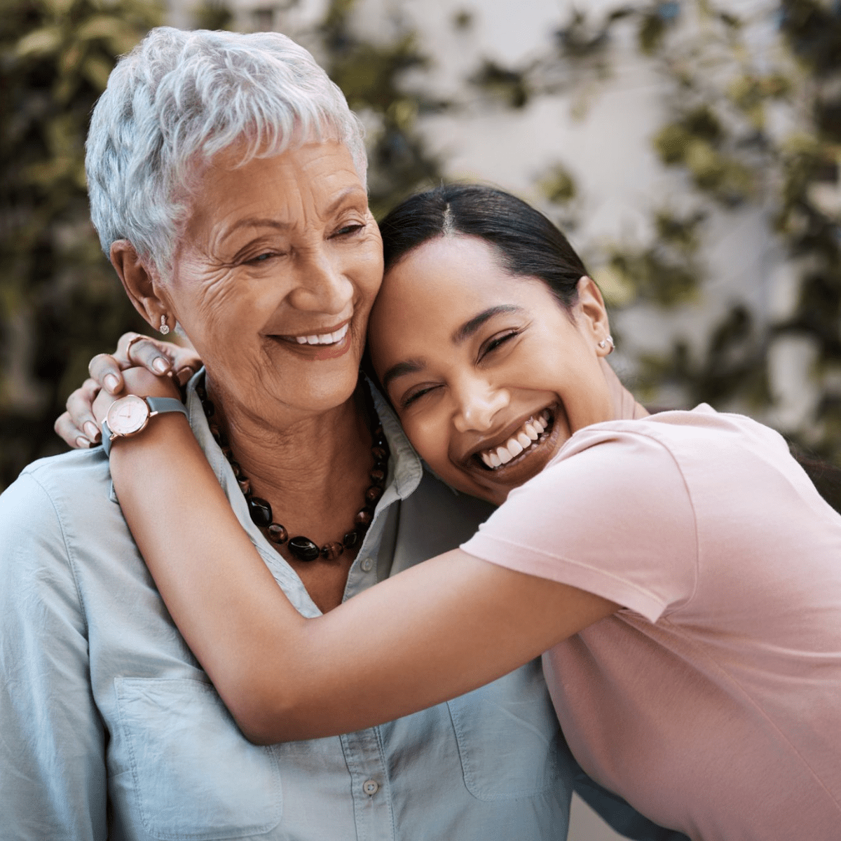 Shot of a senior woman spending time with her daughter in their garden at home