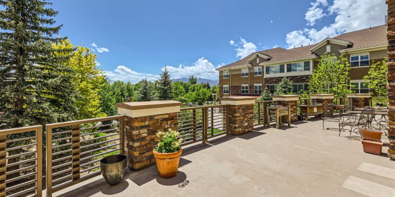 Someren Glen Senior Living Community in Centennial, CO - sunny vista living center exterior patio2