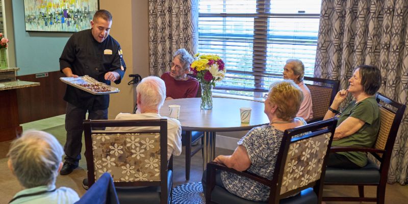 Sunny Vista Senior Living Community in Colorado Springs, CO - duet chef with resident during cooking event landscape