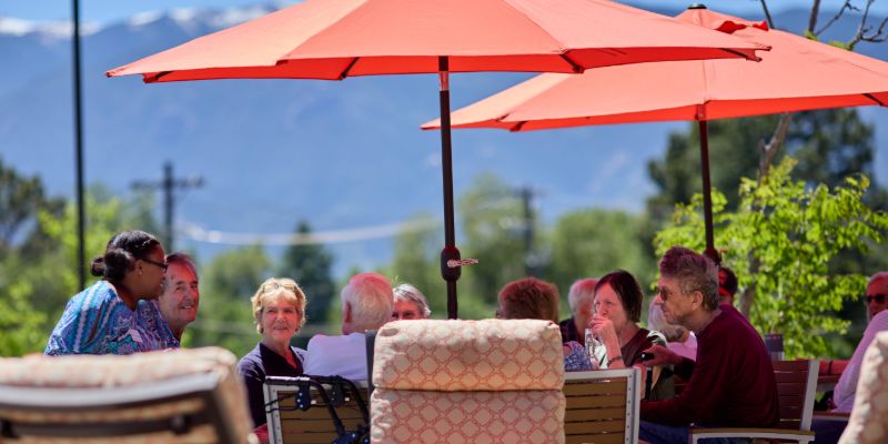 Sunny Vista Senior Living Community in Colorado Springs, CO - resident enjoying the outdoors landscape